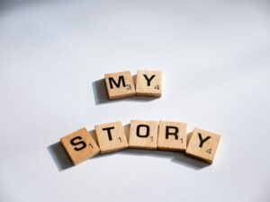 The words "my story" written with scabble letters demonstrates visual storytelling.